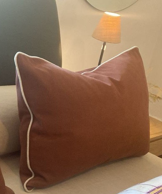 Rust cushion with natural pipping - Incudes feather inner
